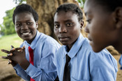 Samira (centre) chats with her friends at her school in Zambia’s Central Province