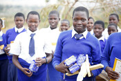 Adolescent girls with their sanitary pads from Plan International