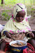 Young girl tucks into bowlful of Doungouri Da mo