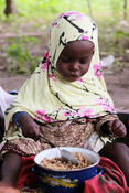 Young girl tucks into bowlful of Doungouri Da mo